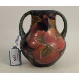 A Moorcroft green handled vase, decorated in the pomegranate pattern, height 5.25insCondition