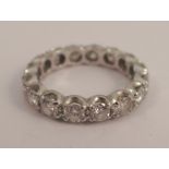 A diamond full eternity ring, in an unmarked white mount, the sixteen brilliant cuts totalling