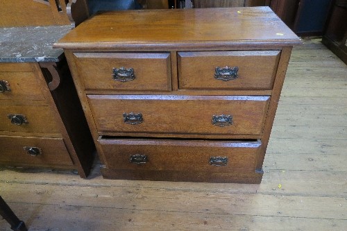 A pollard oak chest of drawers, having two short drawers over two graduated long drawers, width