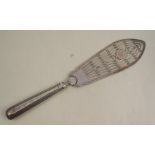 A Georgian silver fish slice, with pierced blade engraved with a crest, London 1785 Condition
