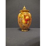 A Royal Worcester quarter lobed covered vase, decorated with hand painted fruit by Roberts, shape