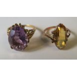 A citrine ring, stamped '9ct', finger size N, together with a similar amethyst set ring, finger size