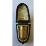 An unmarked gold thimble, early 20th century, in original case (tests as 18ct), 5.7g gross