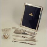 A modern silver mounted photograph frame, together with a quantity of hallmarked silver flatware and