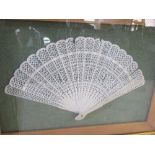 A cased ivory 20 spine leaf fan, with ornamental pierced leaves, width approximately 12ins