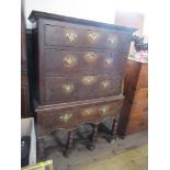 A 18th century style oak chest on stand, fitted three long drawers to the top, over a long drawer,