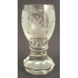 A Masonic firing glass, the bowl engraved with symbols, on a an octagonal base, height 6ins