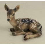 A Rosenthal porcelain figure of a fawn lying down, by Fritz Heidenreich, impressed and printed