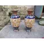 A pair of Royal Doulton Slater vases, decorated with raised gilded flowers and leaves, with blue