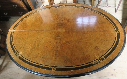 An oval walnut loo table, with ebonised and satinwood inlay, raised on a modern mahogany base, - Image 2 of 3