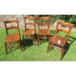 A set of four elm seated chairs