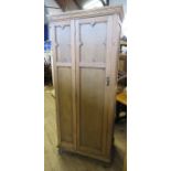 An oak hall cupboard, with single door and carved decoration, height 74.5ins, width 32ins, depth