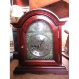 A  modern Wood and Sons, 31 day mantel clock, in a wooden case, height 14ins