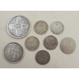 A group of silver and other coins