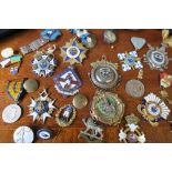 A collection of German gilt metal and enamel badges, to include German veteran medallions,  together