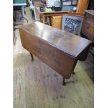 An antique oak drop leaf table, with swing leg, 42ins x 46ins