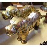A pair of brass dog nut crackers