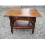 An Art Nouveau style low table, fitted with a drawer and undershelf, 31ins x 18ins x height 23.5ins