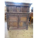 An antique style court cupboard