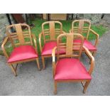 A set of four Art Deco style chairs, with walnut veneered panel to the back