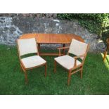 A 20th century D-Scan Danish teak dining suite, comprising table and six chairs (4 + 2), all in good