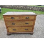 An oak chest of drawers, with mahogany banding, having two short over two long drawers, 38.5ins x