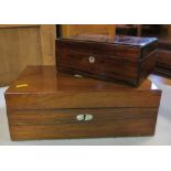 A 19th century rosewood writing box, of rectangular form with mother of pearl roundels, fitted