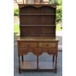 A 20th century oak dresser, height 69ins, width 41ins