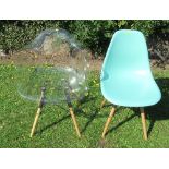 A clear plastic arm chair, on wood and metal legs, together with a similar chair in turquoise