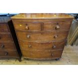 A Victorian mahogany chest of drawers, having two short drawer, over three long graduated drawers,