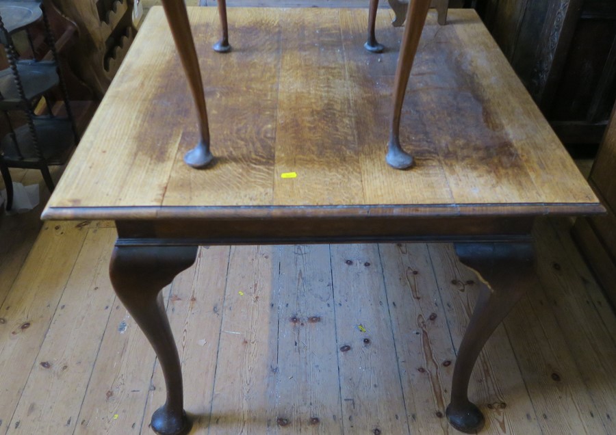 A square oak table, raised on cabriole legs, 36ins x 36ins, height 30ins
