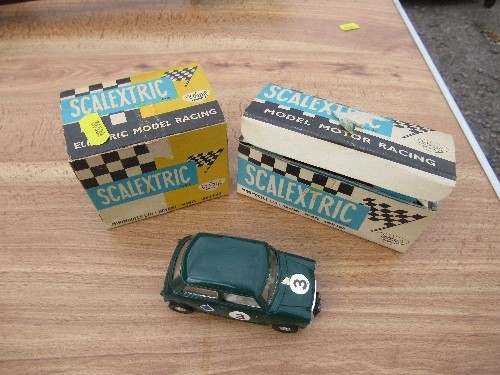 A Scalextric Austin Mini Cooper C76, together with two Scalextric boxes for C/72 BRM and K/1 Go-