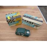 A Scalextric Austin Mini Cooper C76, together with two Scalextric boxes for C/72 BRM and K/1 Go-