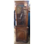 A modern walnut veneered floor standing corner cabinet, with glazed upper section, height 71ins