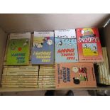 A collection of Snoopy paperback books
