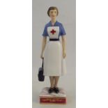 A Royal Worcester figure, British Red Cross Society VAD member, modelled by R van Ruyckevelt, 1969