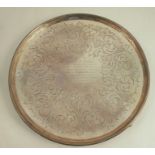 A Georgian silver circular salver, with engraved decoration and presentation inscription, raised