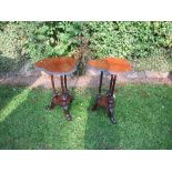 A pair of 19th century mahogany triform tables, raised on three spindle legs, terminating on a