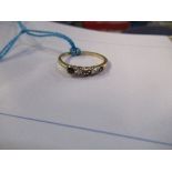 0001 - A sapphire and diamond ring, set in gold, two sapphires missing
