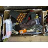 A box of gun cleaning items etc