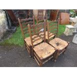 A set of 4 ladder back chairs, with rush seats