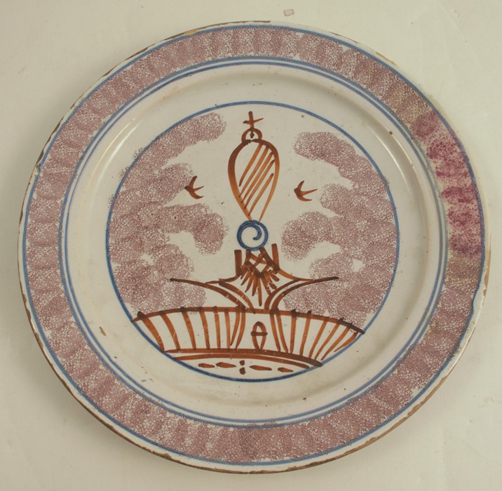 An early Bristol Delft sponged plate, with manganese decoration, diameter 8.75ins -