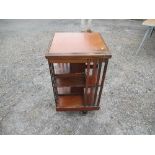 A mahogany revolving bookstand, 19ins x 19ins x height 33.5ins
