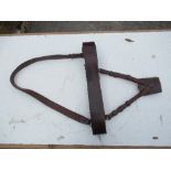 A military Sam Brown leather belt, with body strap, holder for sword and brass buckles