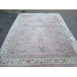 A Chinese wool wash rug, in pink, 122ins x 95.5ins