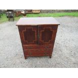 A 19th century mahogany cabinet, with satinwood inlay,  having a pair of cupboard doors over two