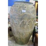 A large 20th century floor standing pot, decorated with fish, height 24.5ins