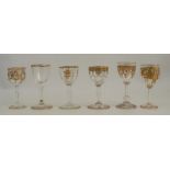 Six 19th century drinking glasses, all decorated with gilt to different shaped bowls, height 3.5ins