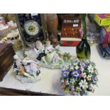 Two Continental porcelain figure groups, together with a porcelain floral basket and a glass bird