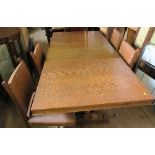 An oak draw leaf dining table, closed 48ins x 32ins, open 66ins, together with four dining chairs